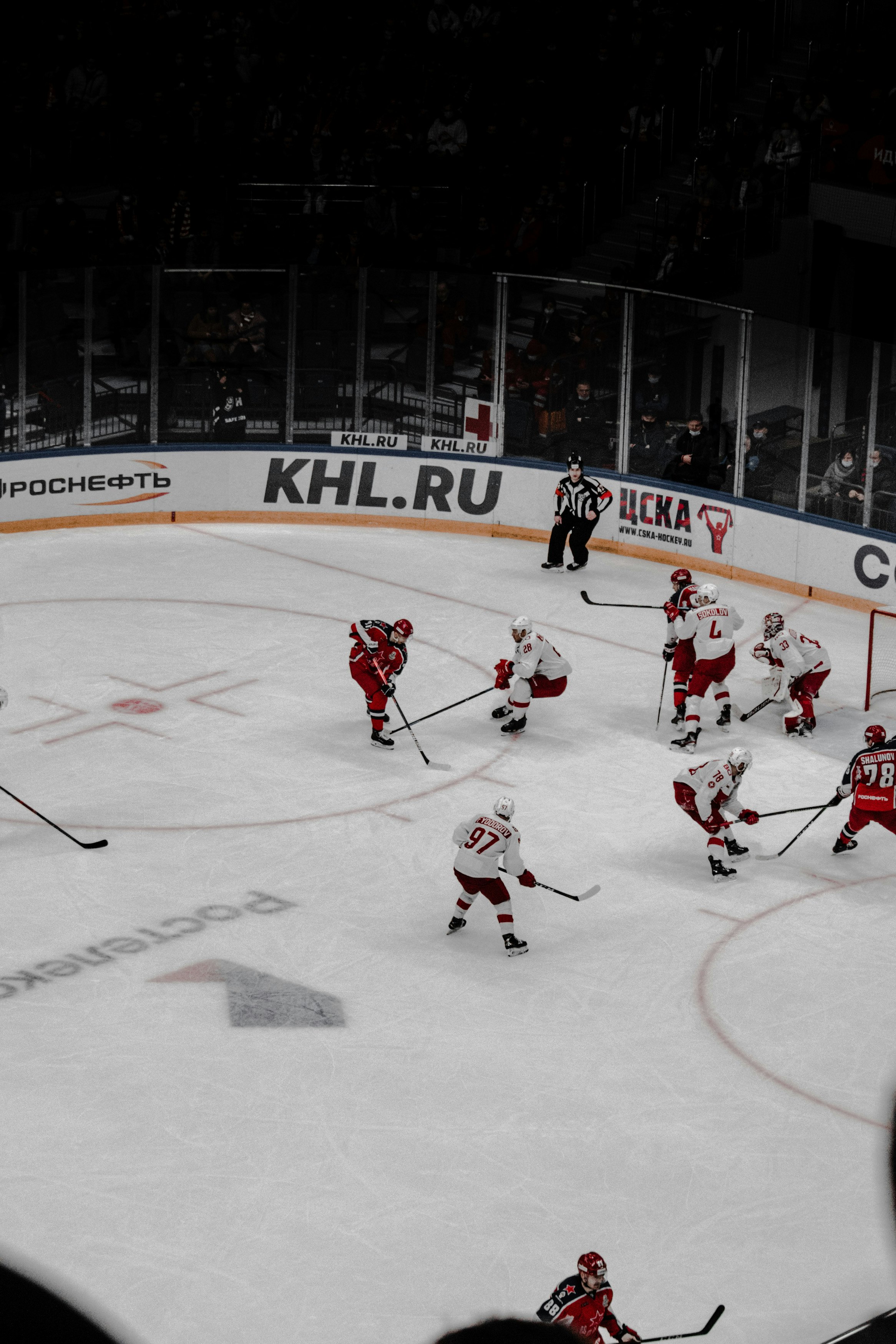 people playing ice hockey on ice stadium